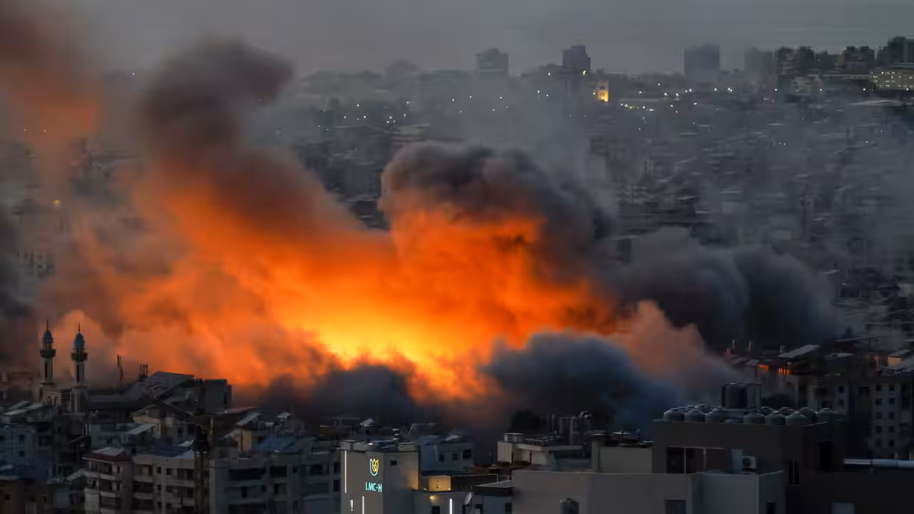 Lebanon Tyre explosions news showing smoke rising over coastal city