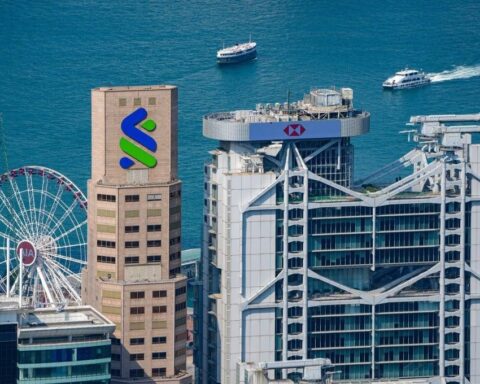AI job cuts announcement at Standard Chartered headquarters in Hong Kong 2026