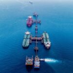 Oil tankers passing through the Persian Gulf highlighting Strait of Hormuz security concerns