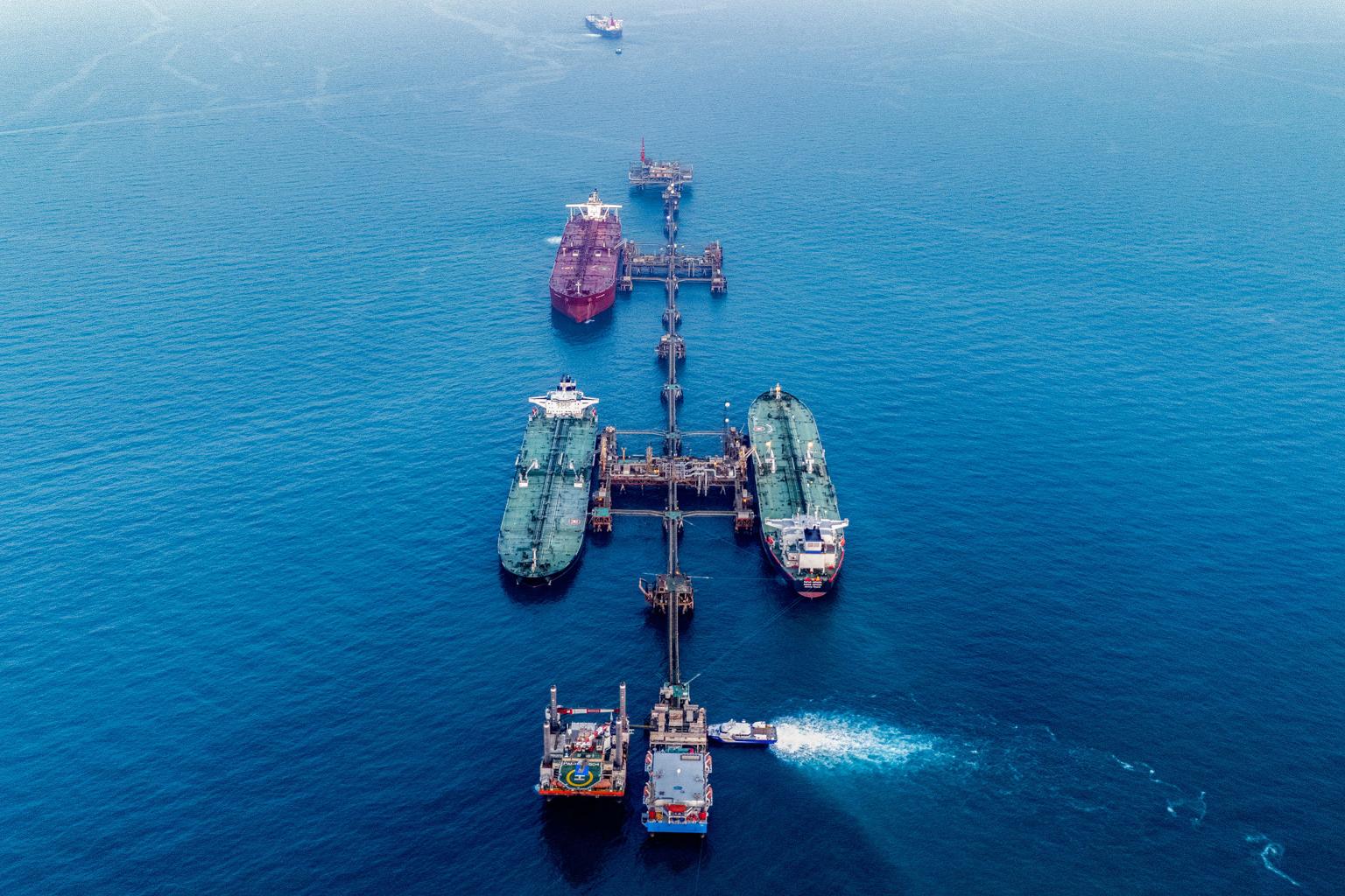 Oil tankers passing through the Persian Gulf highlighting Strait of Hormuz security concerns