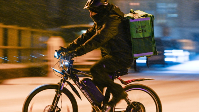 Uber Europe Markets Expansion Signals Major Shift London 2026 1 Uber Europe markets courier delivering food orders in London city center
