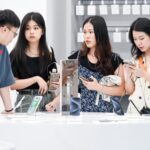 China premium phone sales as consumers compare flagship phones in retail market