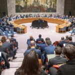 global humanitarian response in Gaza with aid workers distributing food to civilians