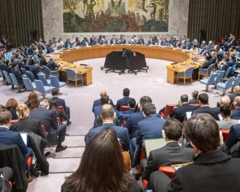 global humanitarian response in Gaza with aid workers distributing food to civilians