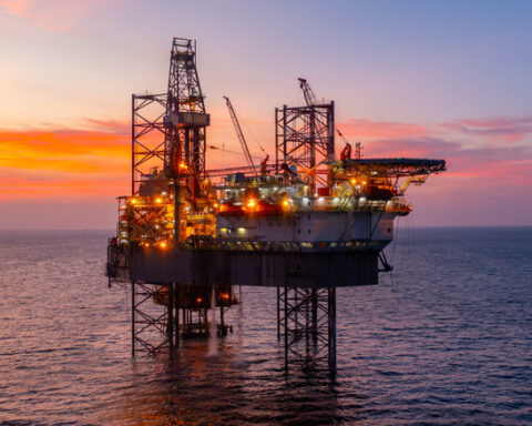 Oil prices impact currency trends shown on forex trading screens with declining Canadian dollar