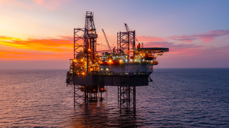 Oil prices impact currency trends shown on forex trading screens with declining Canadian dollar