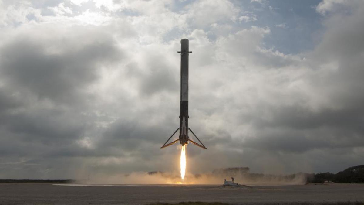 rocket booster landing success showing Blue Origin booster touching down on landing pad