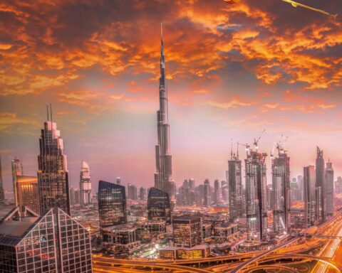 travelers waiting at Dubai International Airport during humanitarian travel crisis