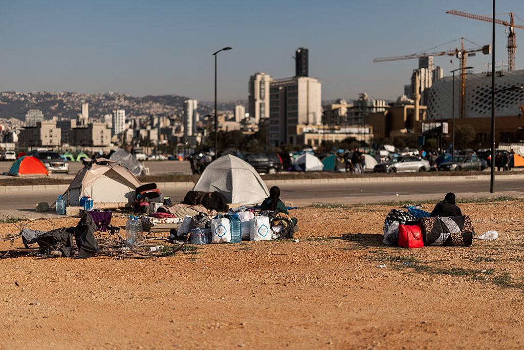 War Displacement Turns Beirut Waterfront Into Tent City 2026 2 Aid workers helping families during Beirut displacement crisis in Lebanon