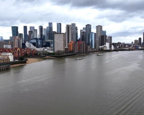 Analysts reviewing stock market performance at UK investment firms