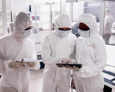 global chip shortage update engineers working in semiconductor fabrication facility