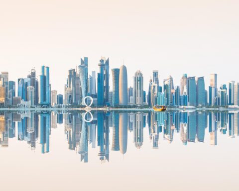 Middle East aviation accident crash site with investigation teams in Qatar desert