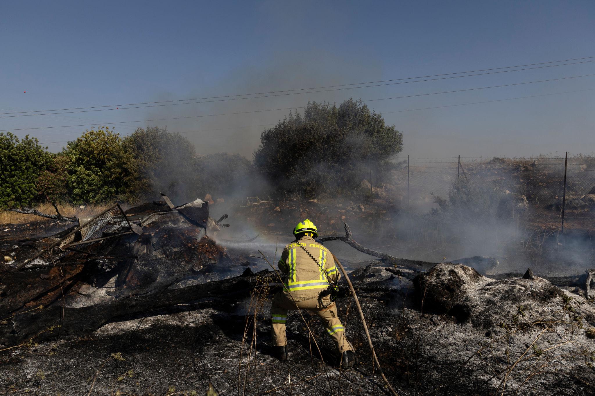 Israel border tensions escalate after drone strike near Lebanon border causing visible smoke