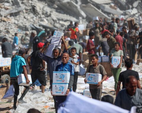 Gaza humanitarian crisis showing damaged buildings and displaced civilians in Gaza 2026