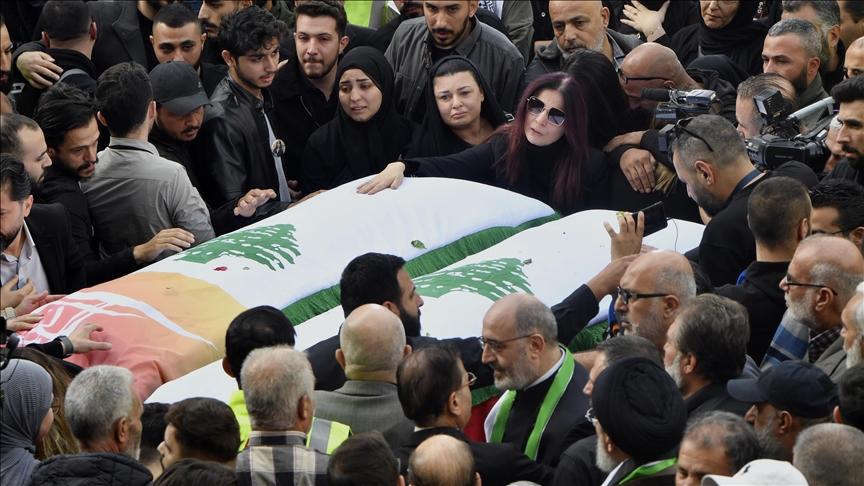 Lebanon journalist funeral news coffins draped in flags procession