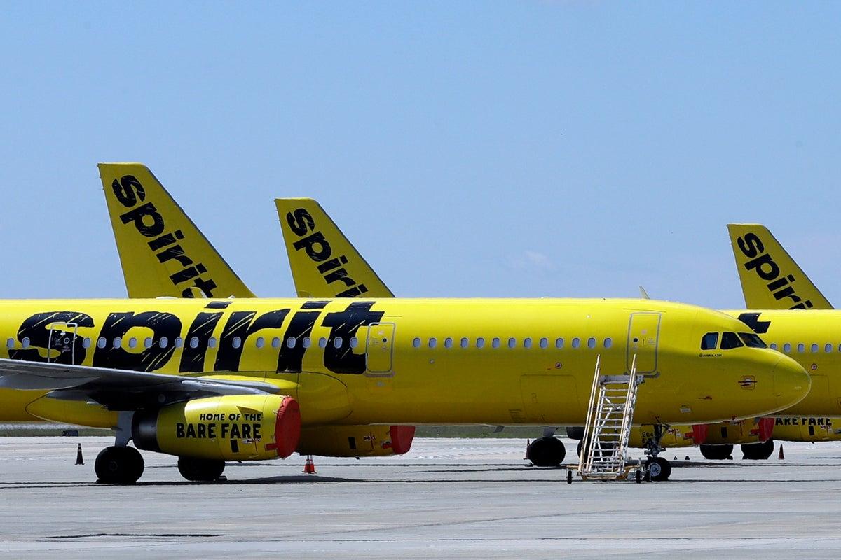 Flight Cancellations Crisis Leaves Thousands Stranded After Airline Collapse USA 2026 4 Stranded passengers sitting with luggage amid flight cancellations crisis delays in USA airports