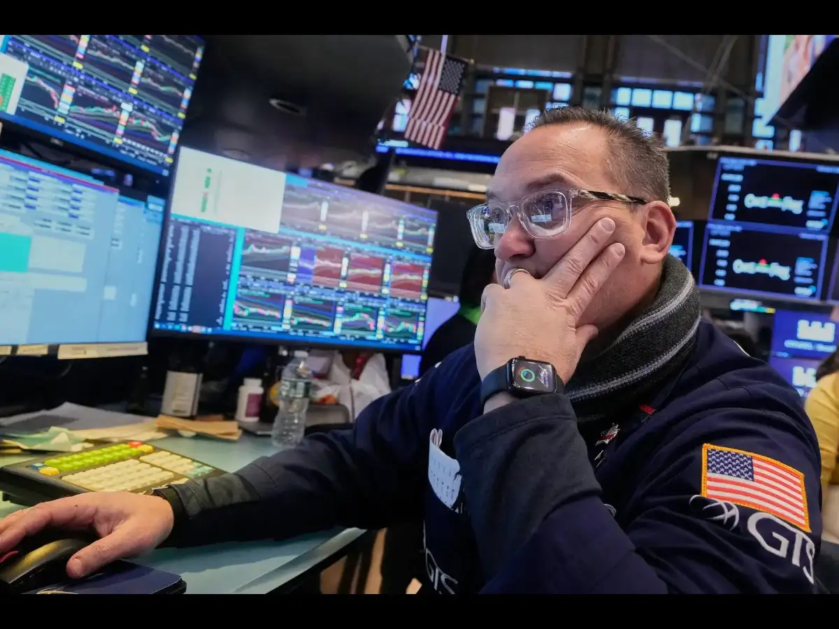 Technology Sector News Warns of Deepening Global Market Turmoil London 2026 2 Financial analyst reviewing data as technology sector news shapes earnings outlook 2026