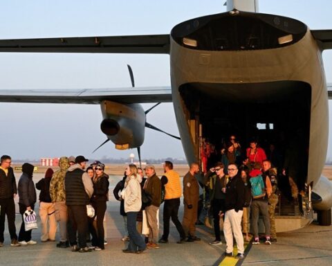 Passengers boarding US emergency flights during Middle East evacuation operation 2026
