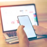 India smartphone recovery outlook with customers buying smartphones in Indian retail store