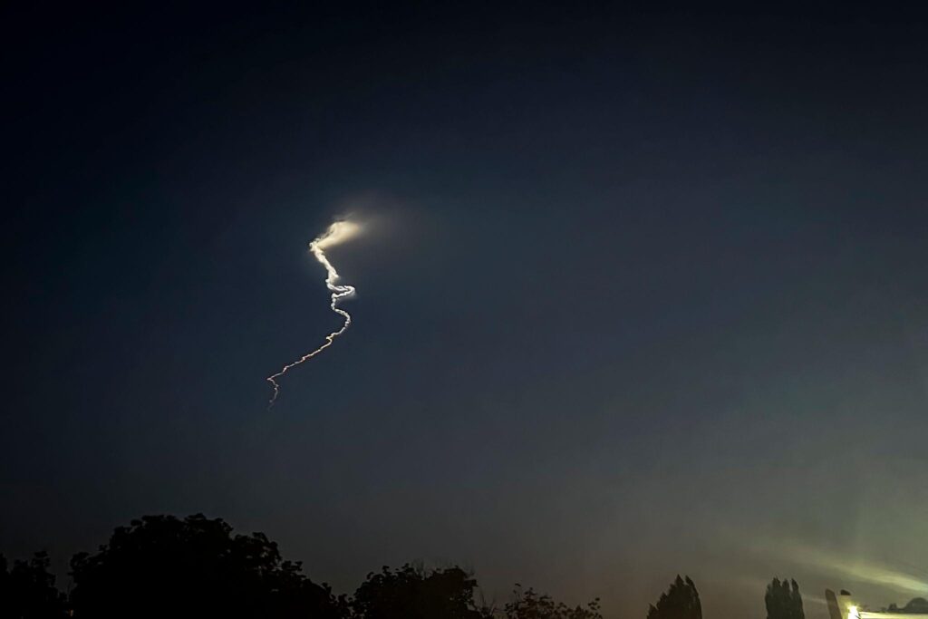 Iran missile launch illuminating the night sky during military operation in Tehran 2026